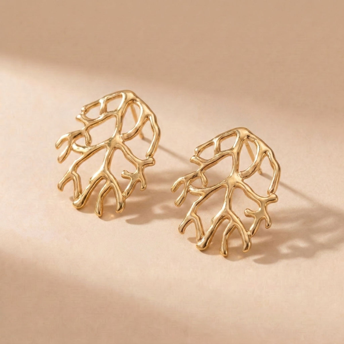 Large coral stud earring in silver and gold