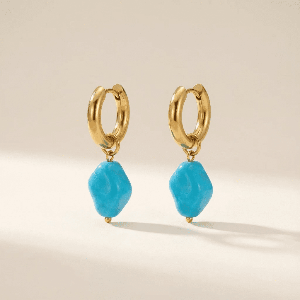 Steel gold hoops with baby blue ceramic