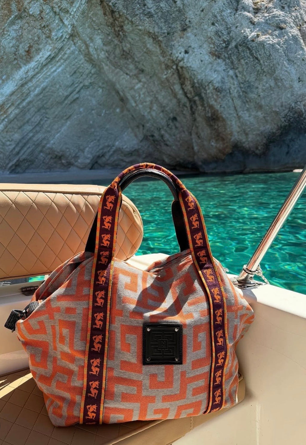 Ames THEROS BAG ORANGE BEIGE lifestyle boat.jpg
