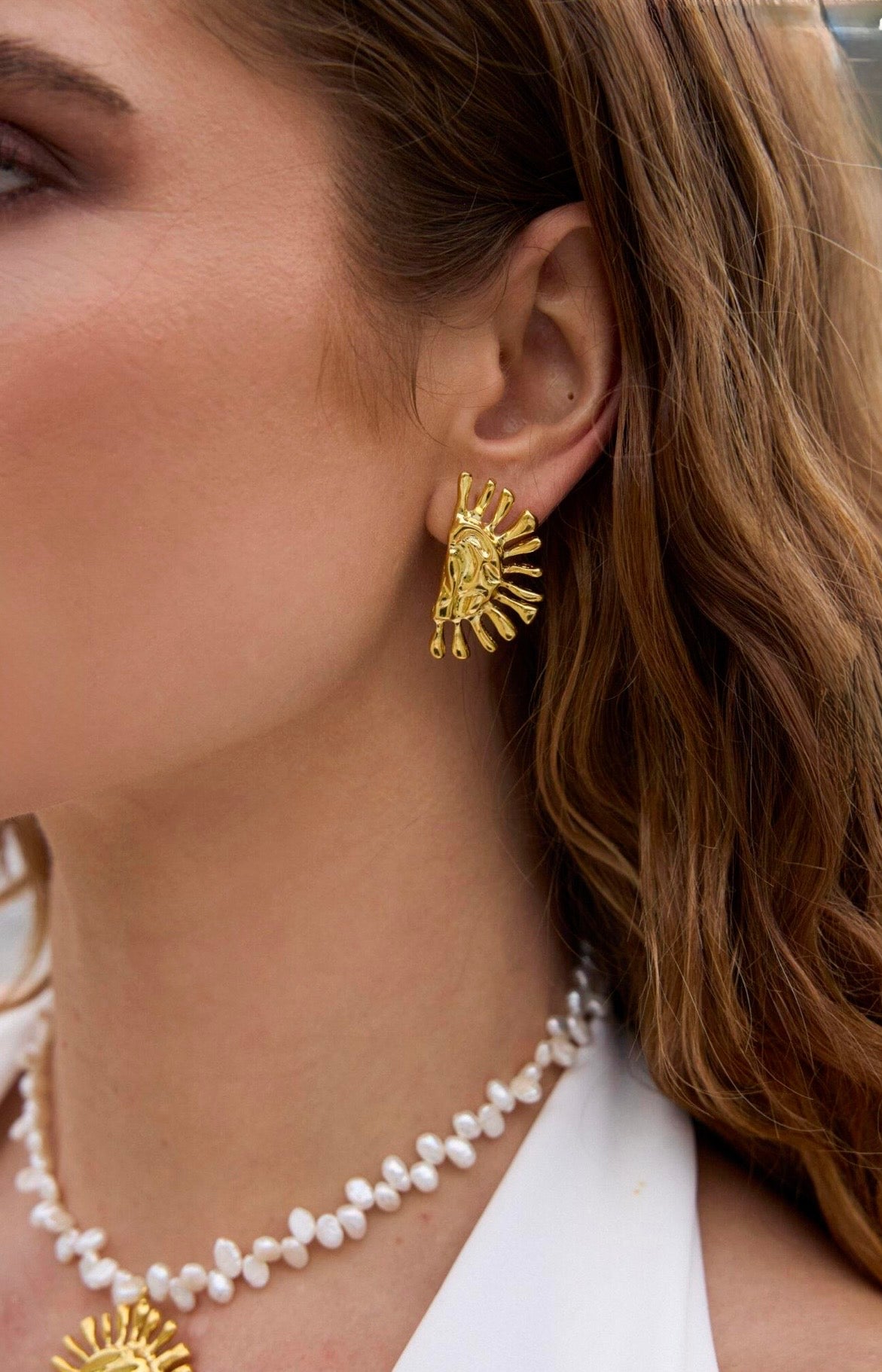 Reve Helia earrings close lifestyle.jpg
