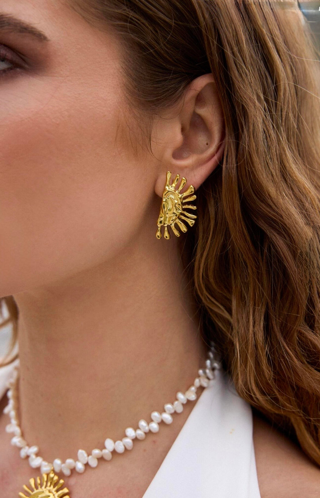 Reve Helia earrings close lifestyle.jpg