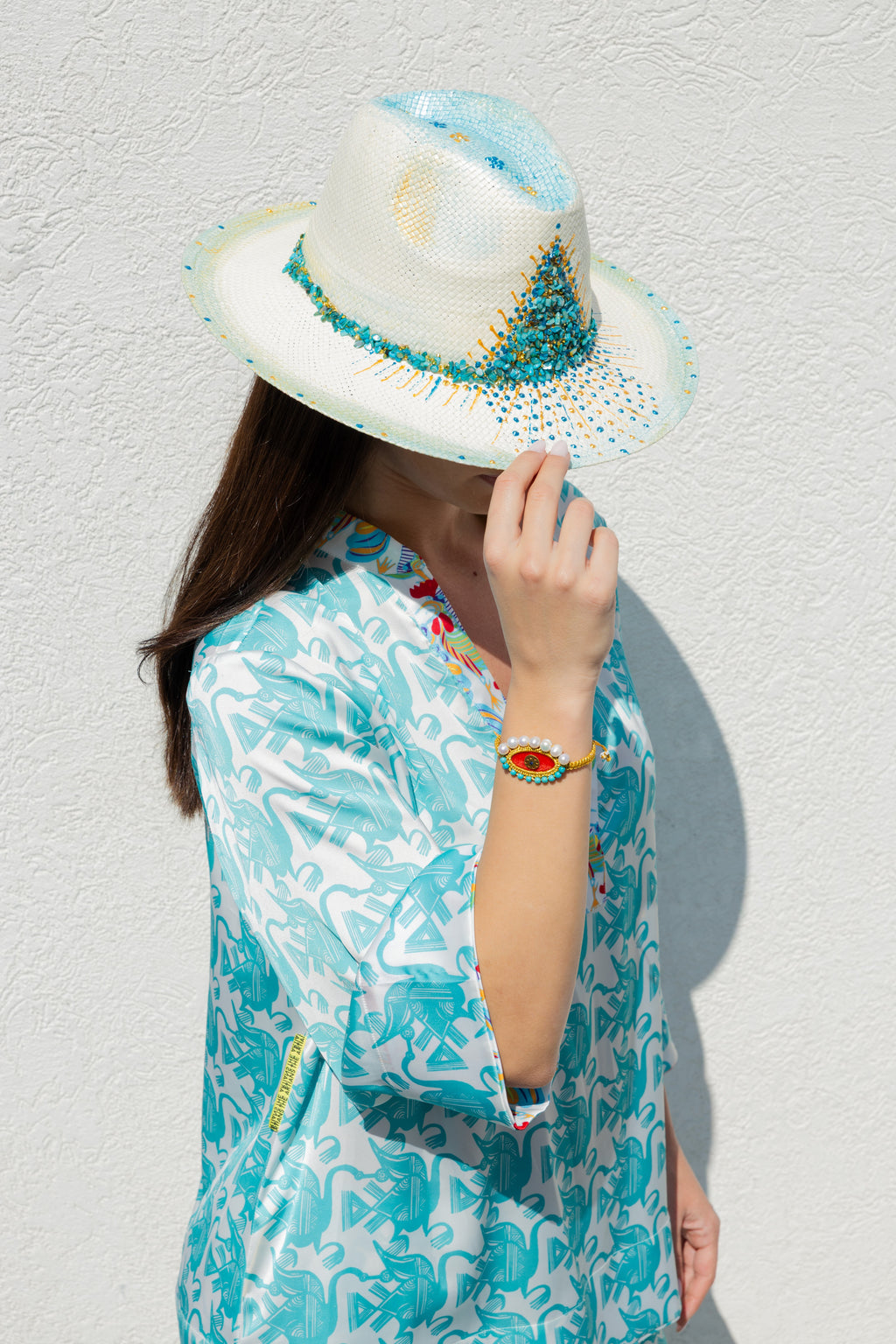 photoshoot mother hats mykonos white hat chase the sun pearl red eye bracelet.JPEG.JPEG